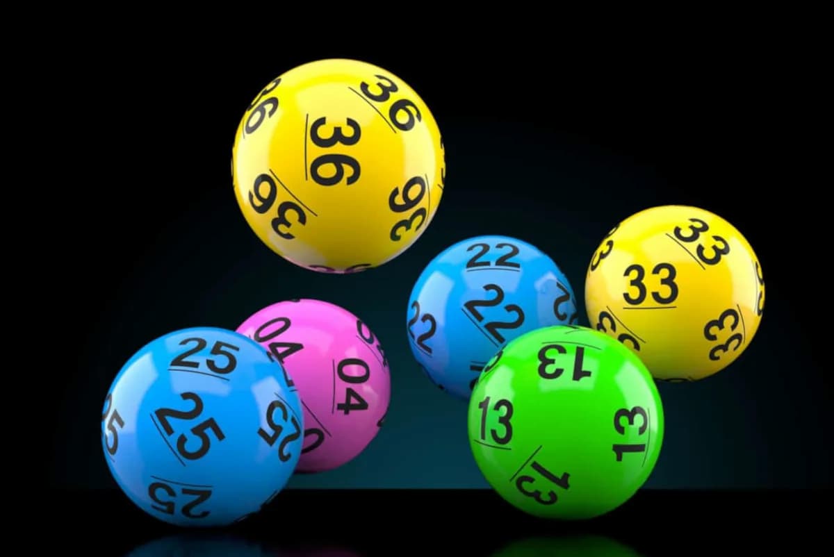 Powerball draw balls suspended in the air. Image accompanies article about the winner of the R179 million jackpot coming forward to claim prize