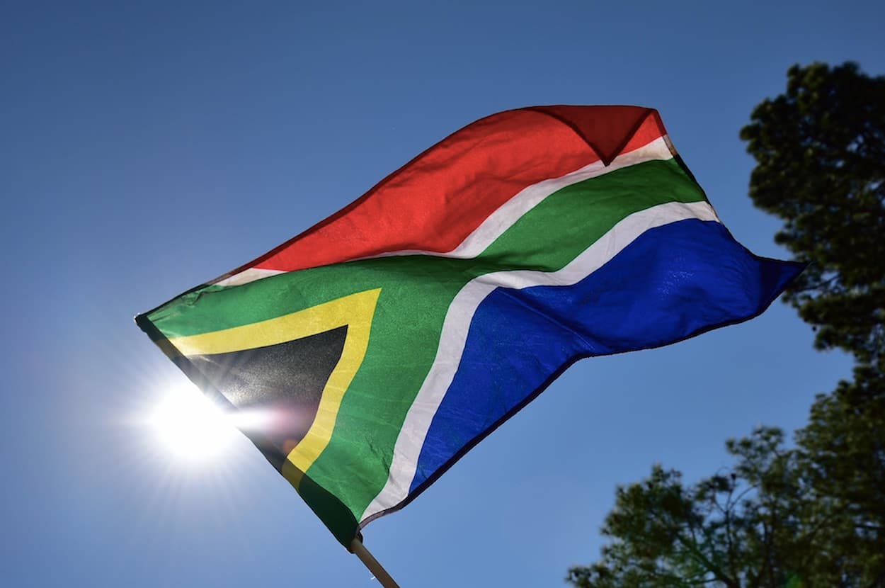 Image of the South Africa's national flag, accompanying an article about South Africa being removed from the EU high risk list