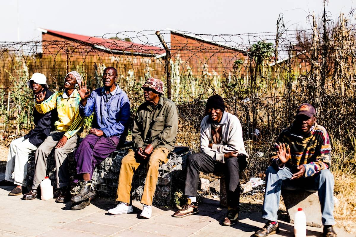 Democratic South Africa, people sitting on the road side
