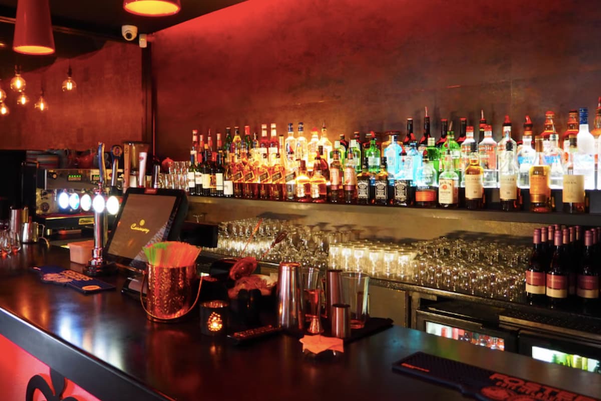 Image of a alcoholic drinks behind a bar. This image accompanies an article about alcohol prices south africa experienced in February 2026, according to Stats SA.